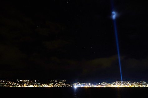 The Night Ship and the Pulse beam against a backdrop of Hobart's waterfront